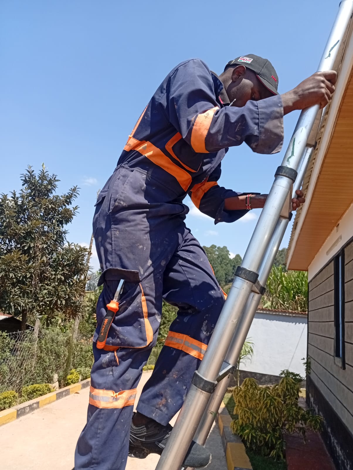 Step Up Smart Solutions Certified Engineer scaling ladder for high-altitude CCTV mounting